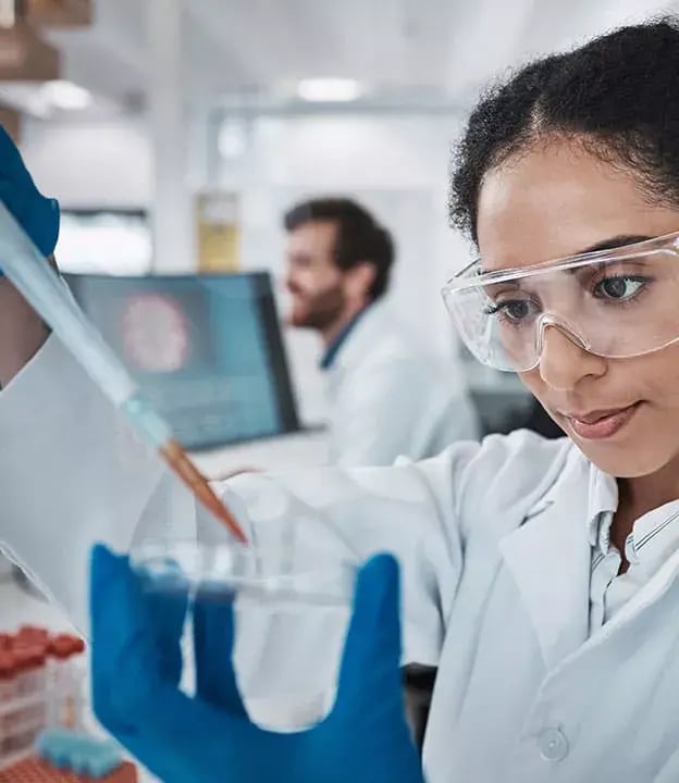 2_Scientist-in-a-lab-looking-at-a-formulation-or-drug-624x720-1-1