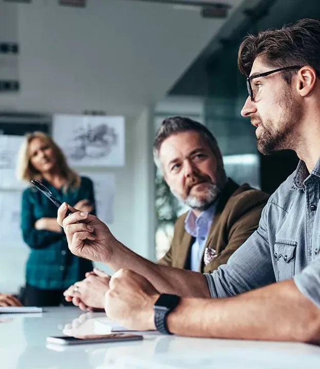 2_Meeting-room-with-professionals-talking-624x720-1